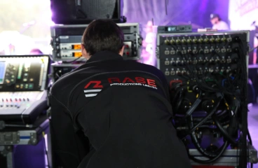 Technician working on audio equipment